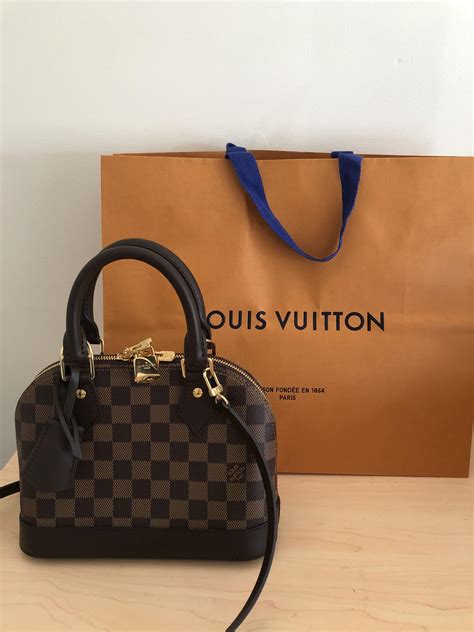 Help deciding between Alma bb or Kensington : r/Louisvuitton